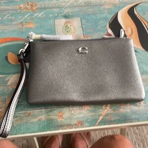 Coach wristlet, pewter, never used.